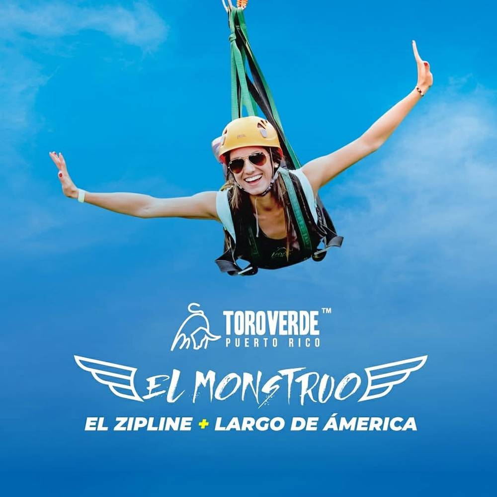 A visitor flying head-first along El Monstruo, the zip line at Toro Verde in Orocovis, Puerto Rico